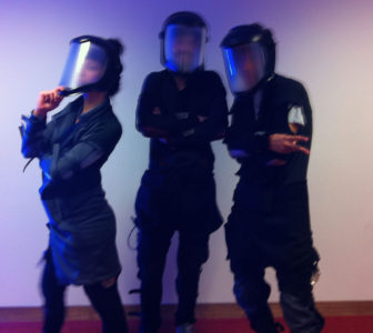Three participants wearing the garment.